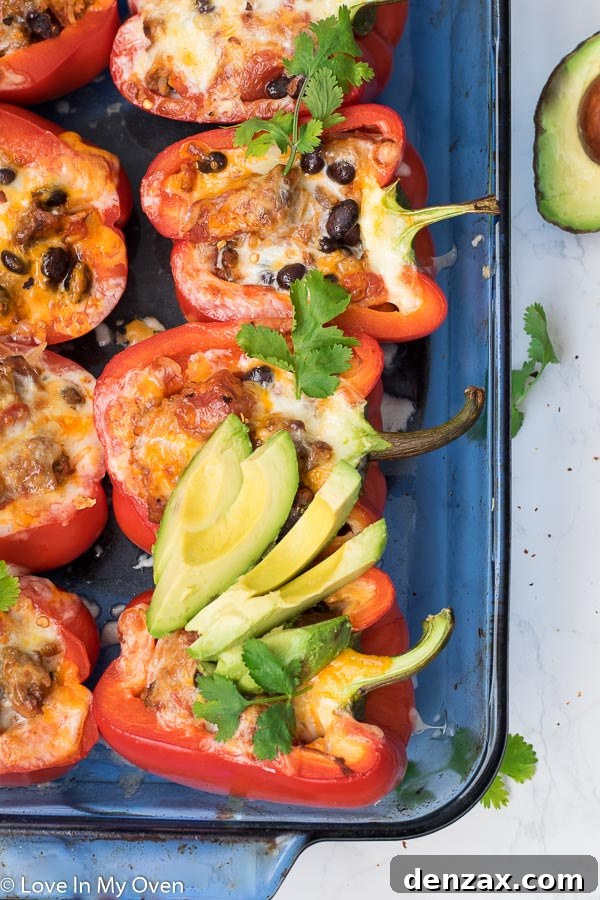 Close-up of freshly baked chorizo stuffed peppers with melted cheese on top