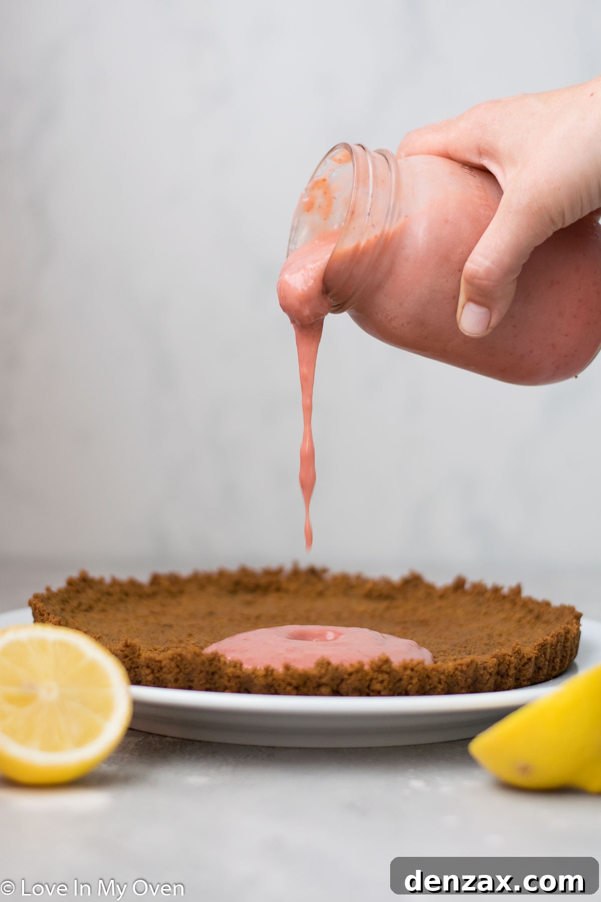 A whole strawberry lemon curd tart, chilling in the refrigerator.