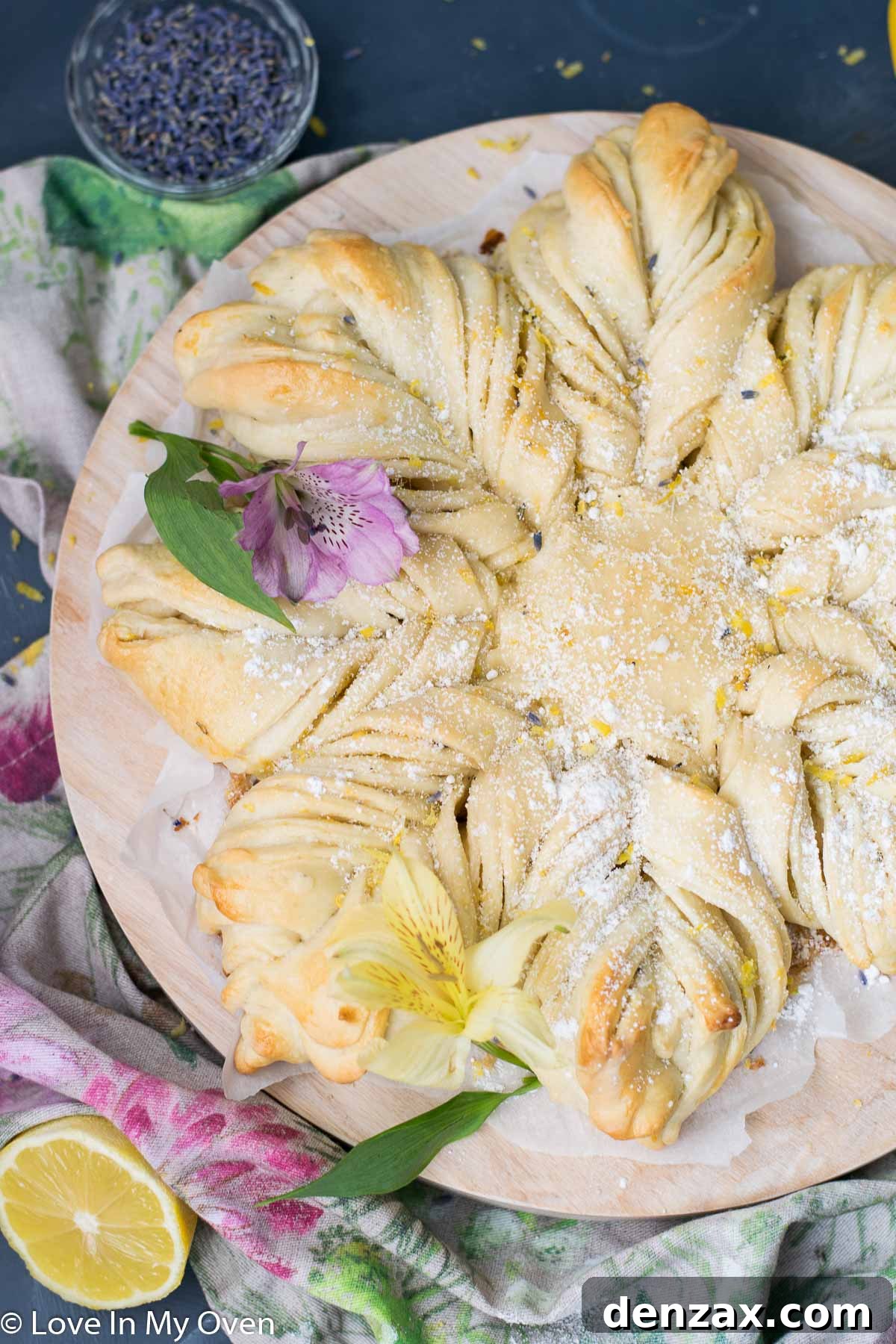 A slice of Star Lemon Lavender Bread, revealing the vibrant layers of lemon and lavender filling swirled within the soft bread.