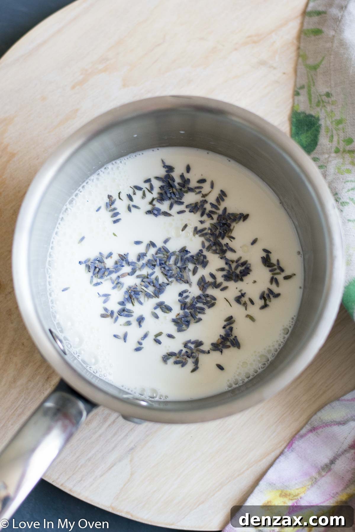 Mixing bowl with yeast, sugar, and lavender-infused milk, preparing the dough for Star Lemon Lavender Bread.