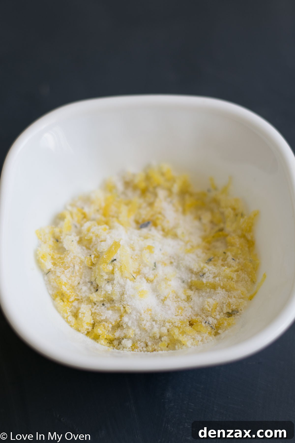 The prepared lemon and lavender filling, a fragrant mixture of sugar, lemon zest, and dried lavender, ready for use.