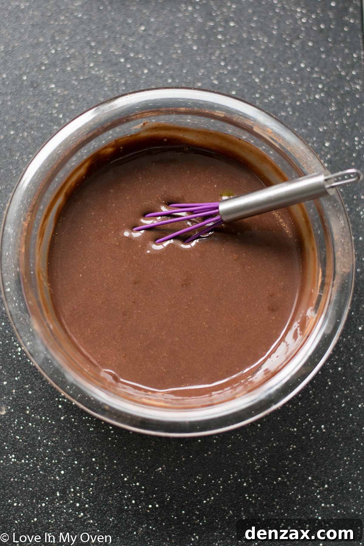 Whisking cocoa powder into condensed milk