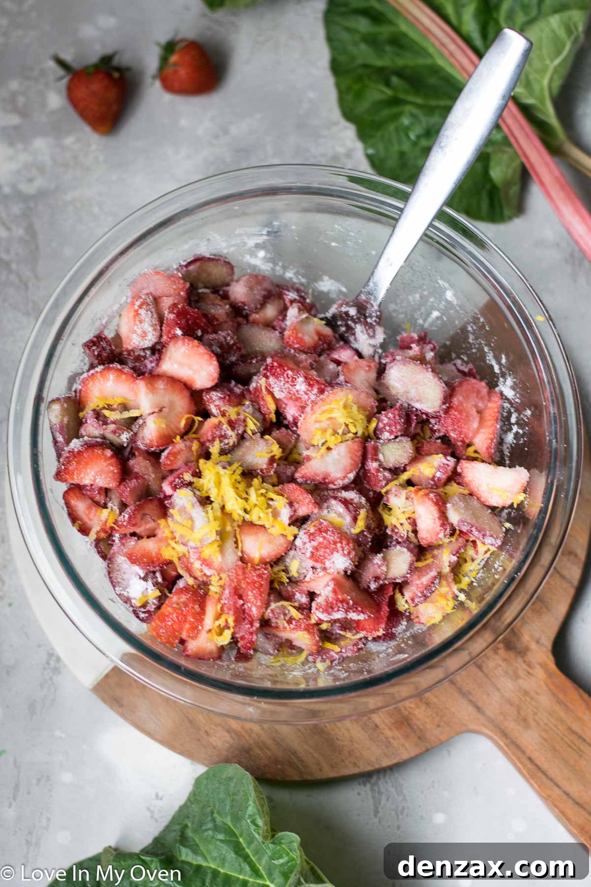 Strawberry rhubarb pie filling freshly poured into a pie crust