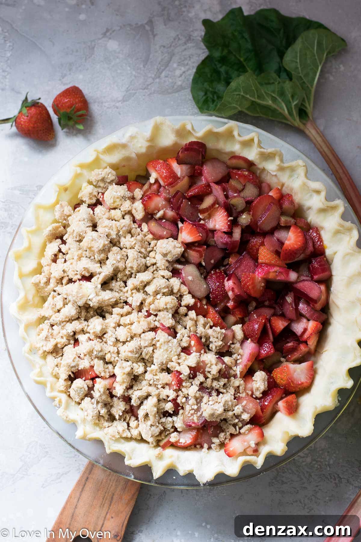 Freshly baked strawberry rhubarb crumble pie, steam rising