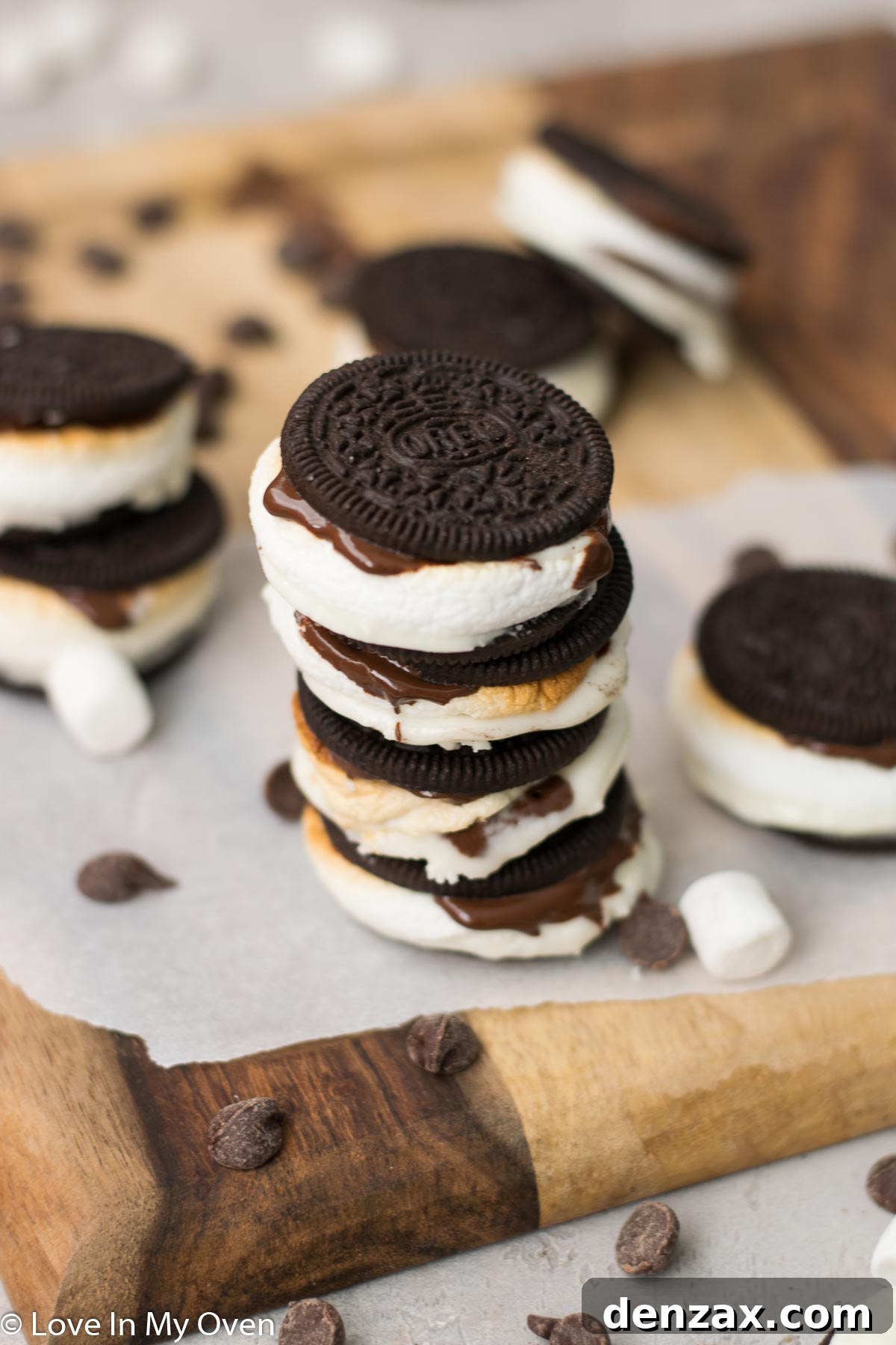 Mallow Cookie Meltdown 3 s'moreos - preparation with separated Oreos, chocolate chips, and marshmallows