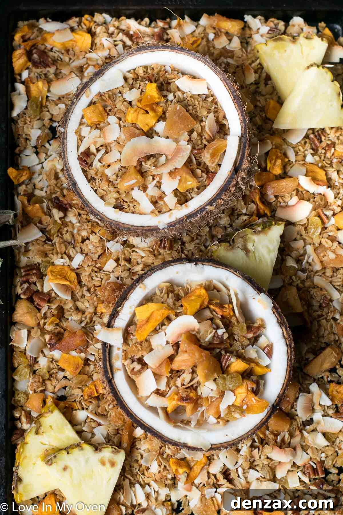 Close-up of tropical granola clusters with dried mango, pineapple, and coconut flakes