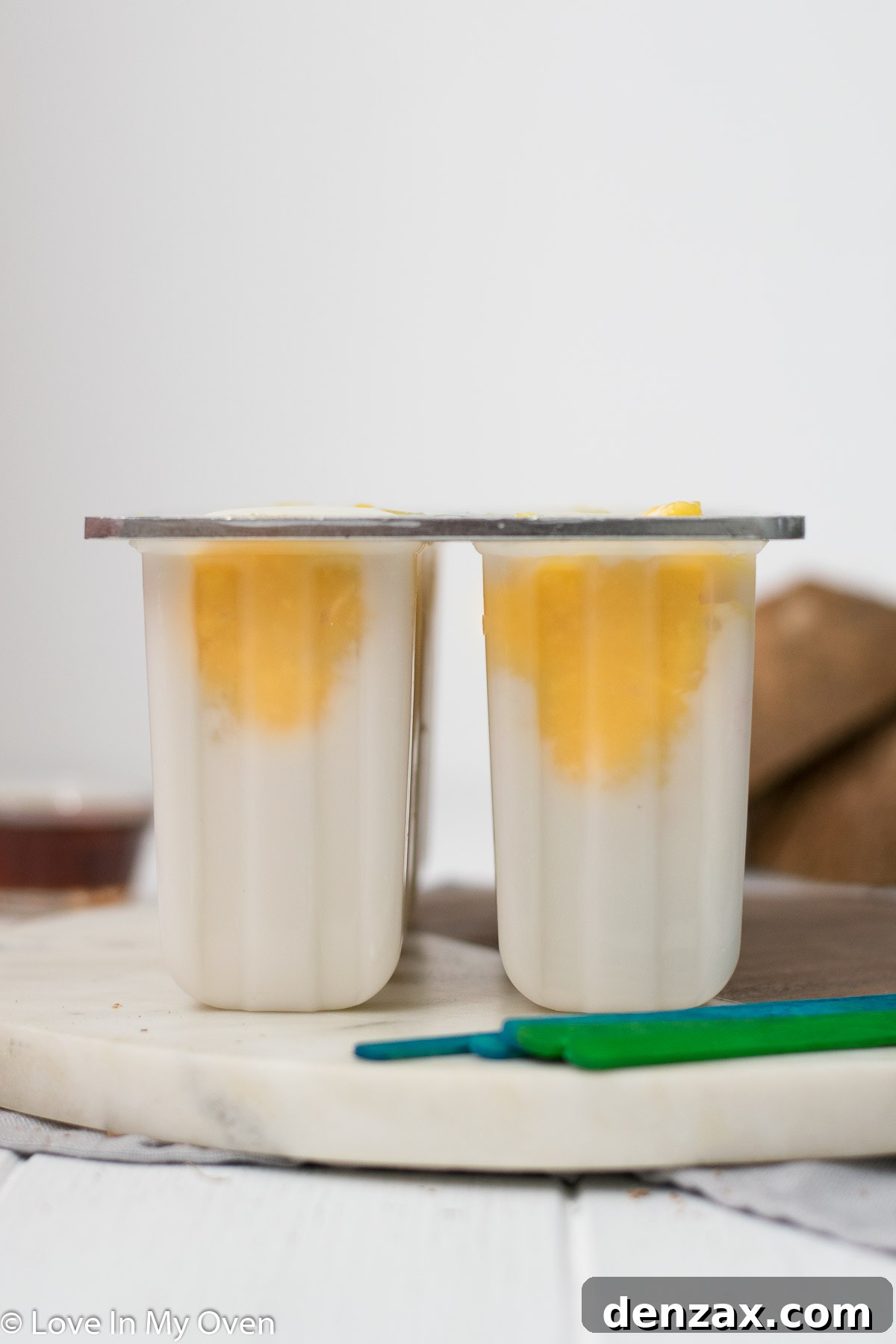 Finished layered mango coconut popsicles