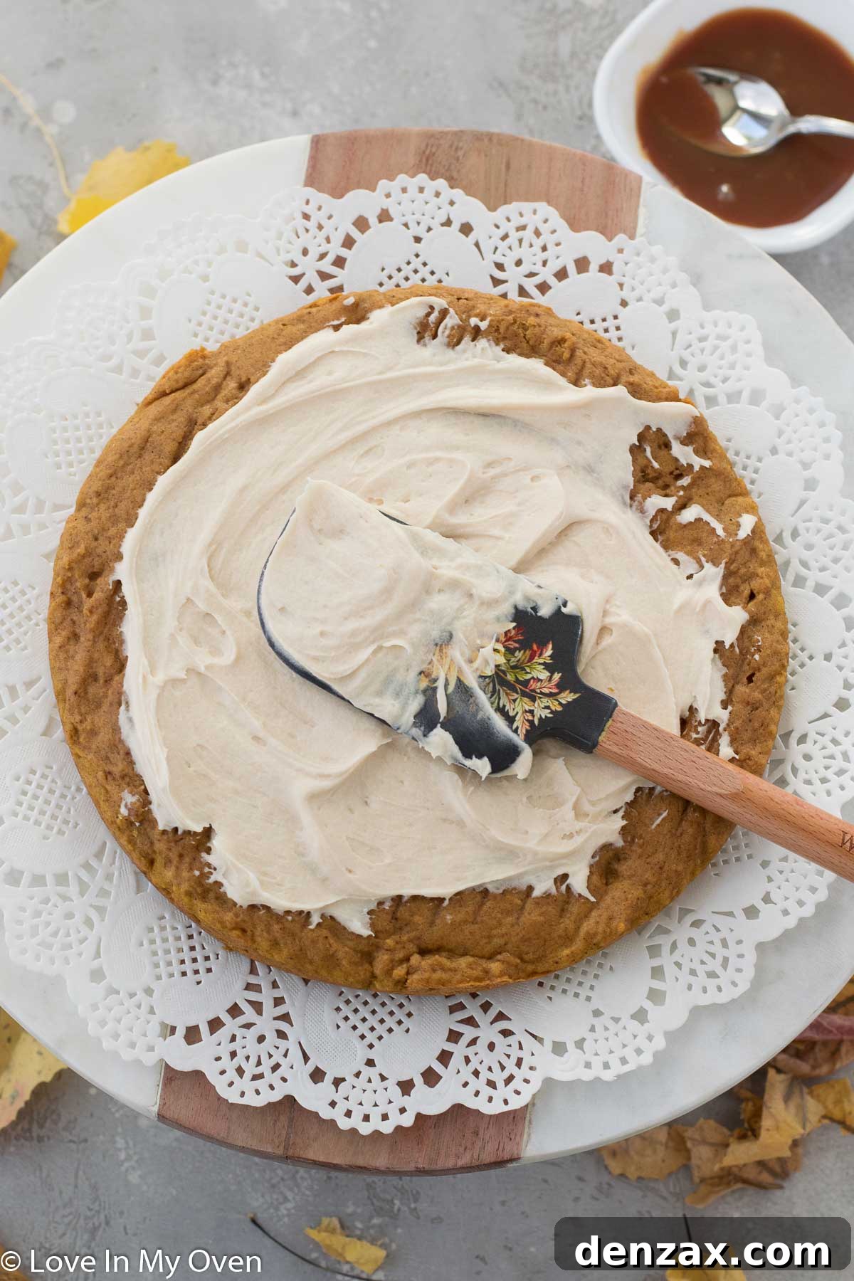 Bowl of freshly made caramel cream cheese frosting, smooth and ready.