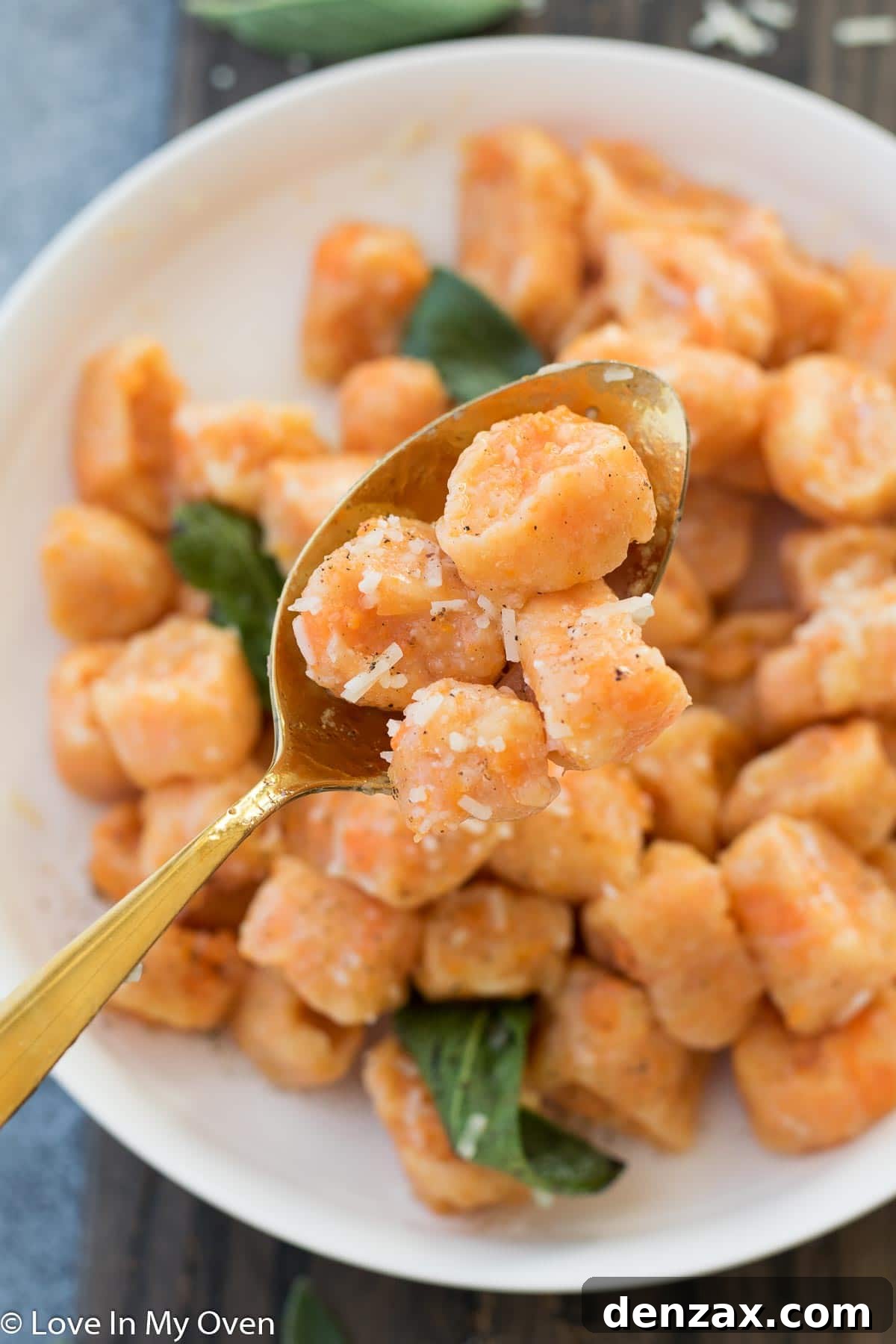 Overhead view of a bowl of sweet potato gnocchi with sage and cheese