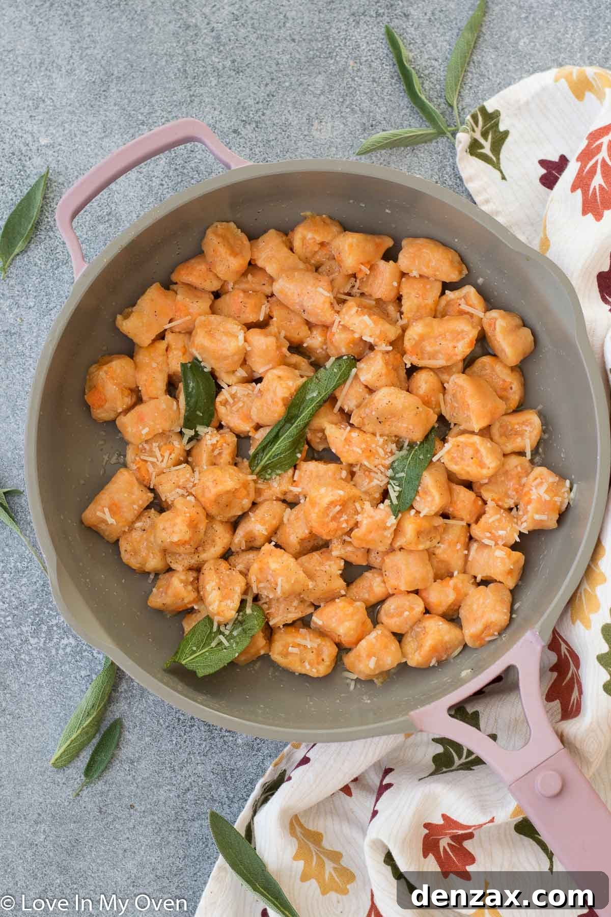 Close-up of golden sweet potato gnocchi being tossed in sage butter sauce
