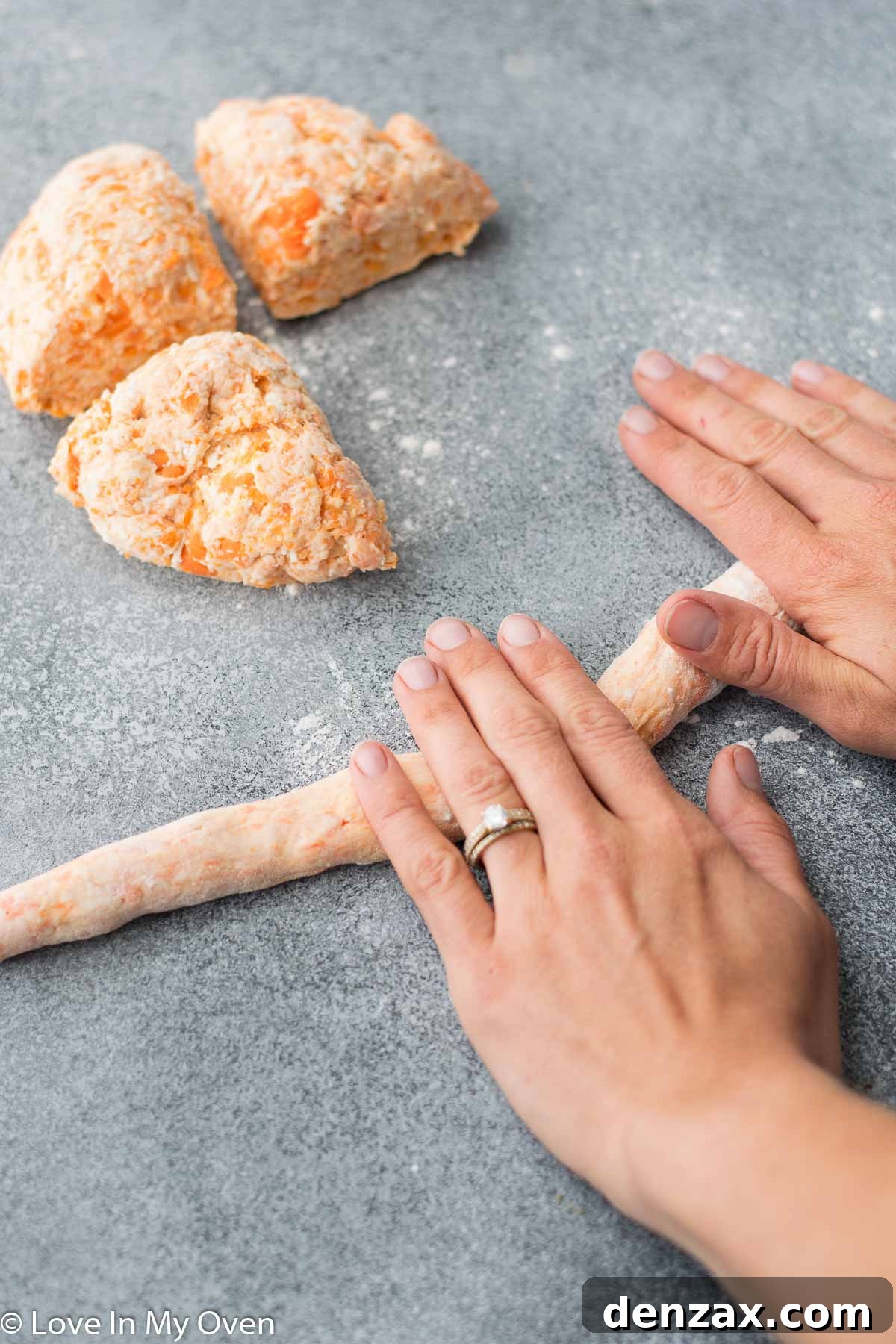 Gnocchi dough being rolled into ropes on a floured surface