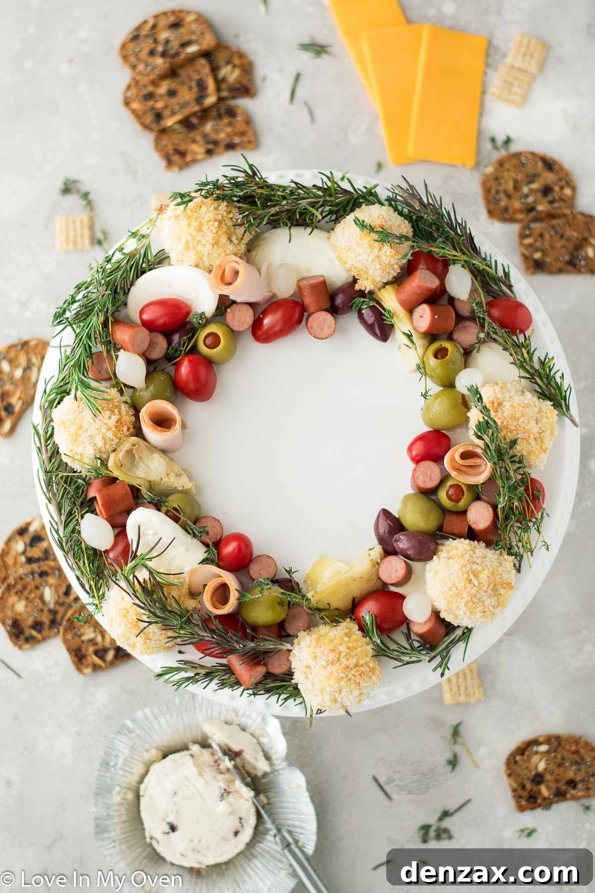 Beautifully arranged holiday charcuterie wreath on a wooden board