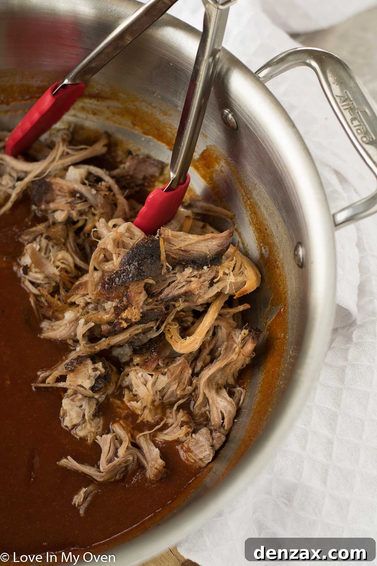 A large cut of raw pork shoulder, ideal for pulled pork.