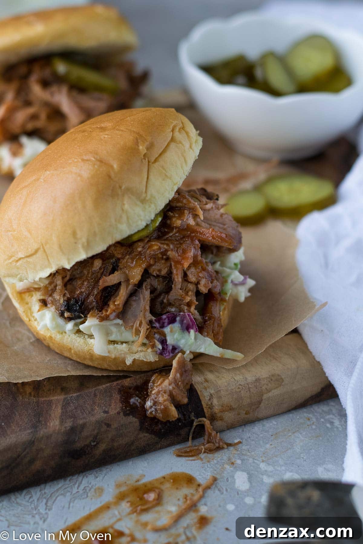 Close-up of a serving of apple cider pulled pork with visible texture.