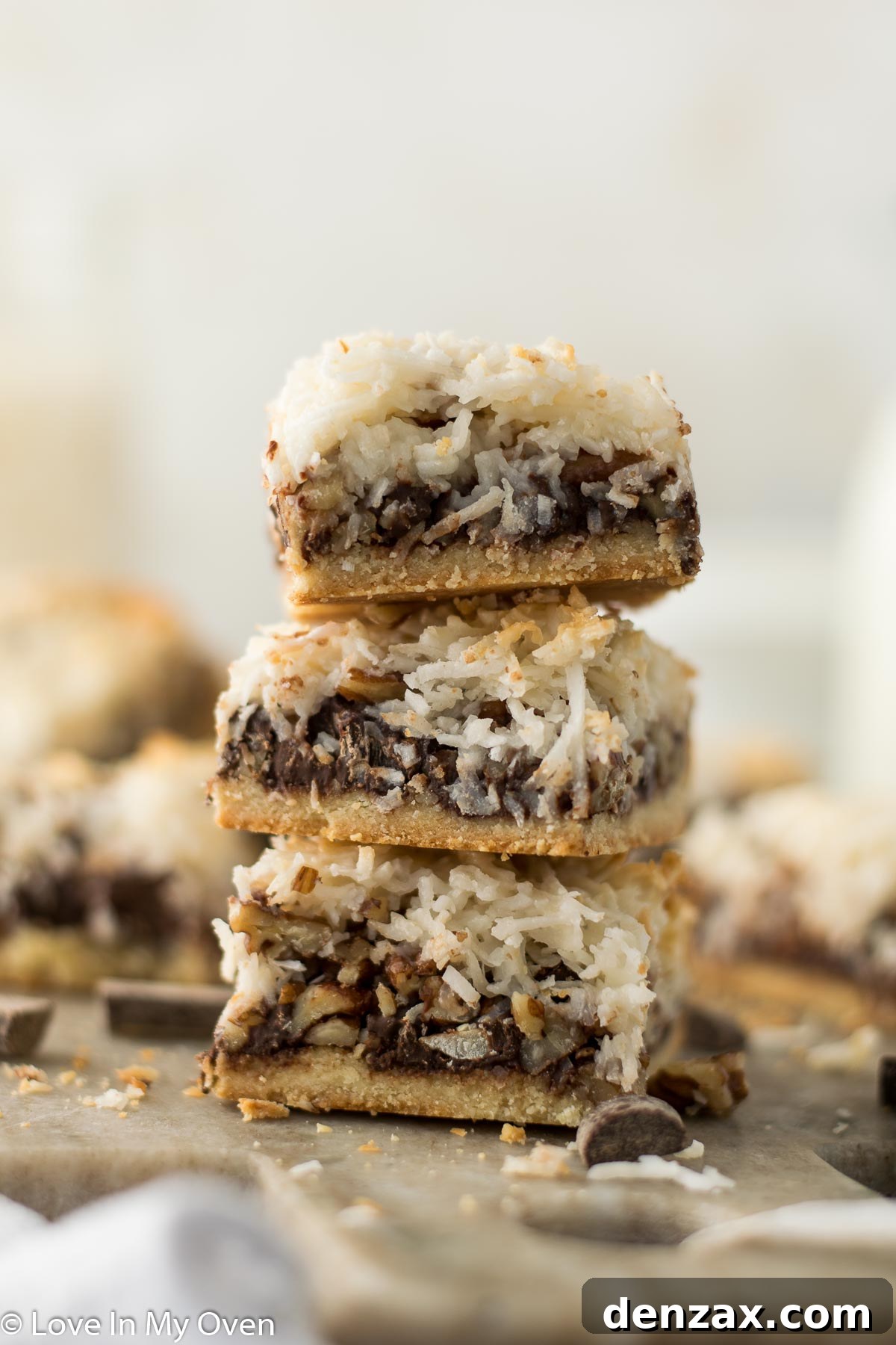 Delightful vegan magic bars arranged beautifully on a serving tray, showcasing their layered texture and golden-brown top. Perfect for a healthier dessert option.