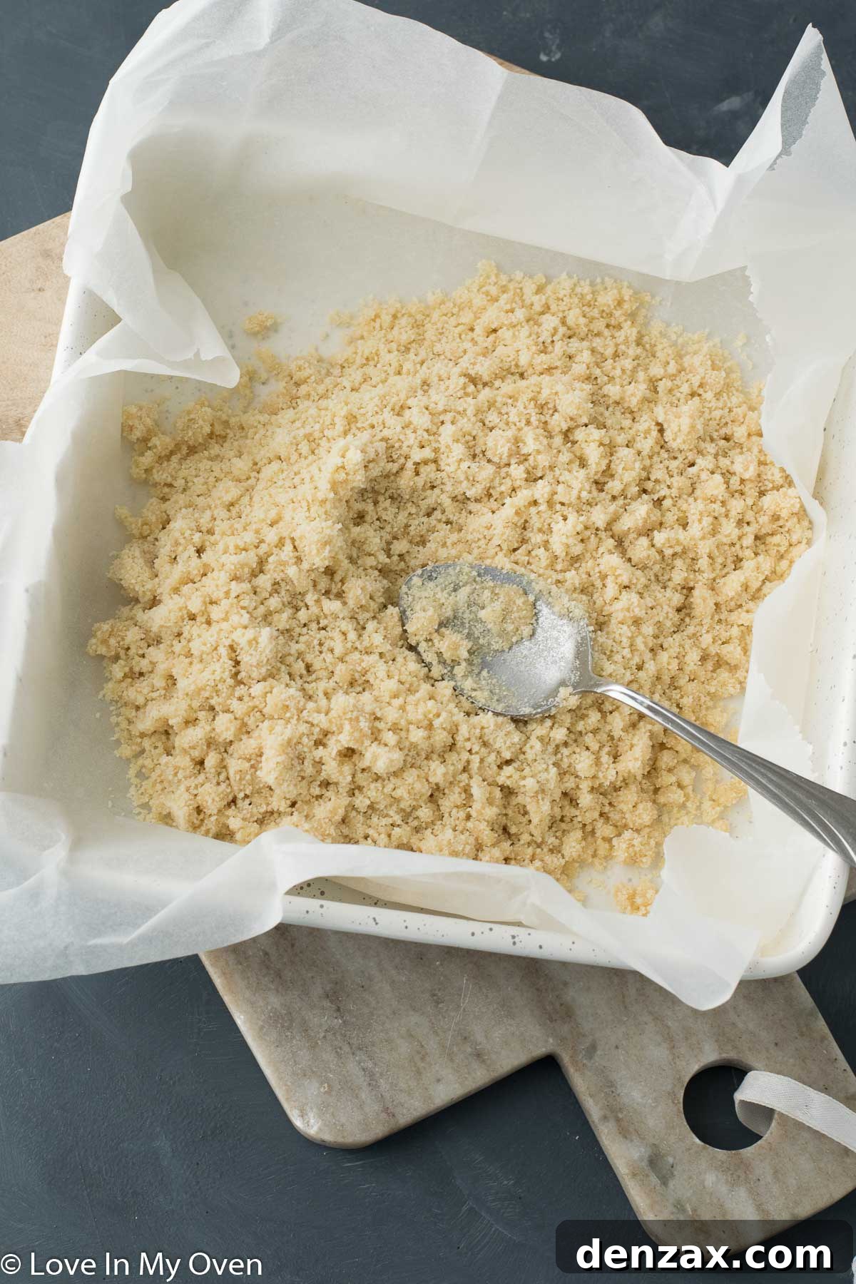 The perfectly pressed almond flour crust, ready for its delicious layers of vegan toppings.
