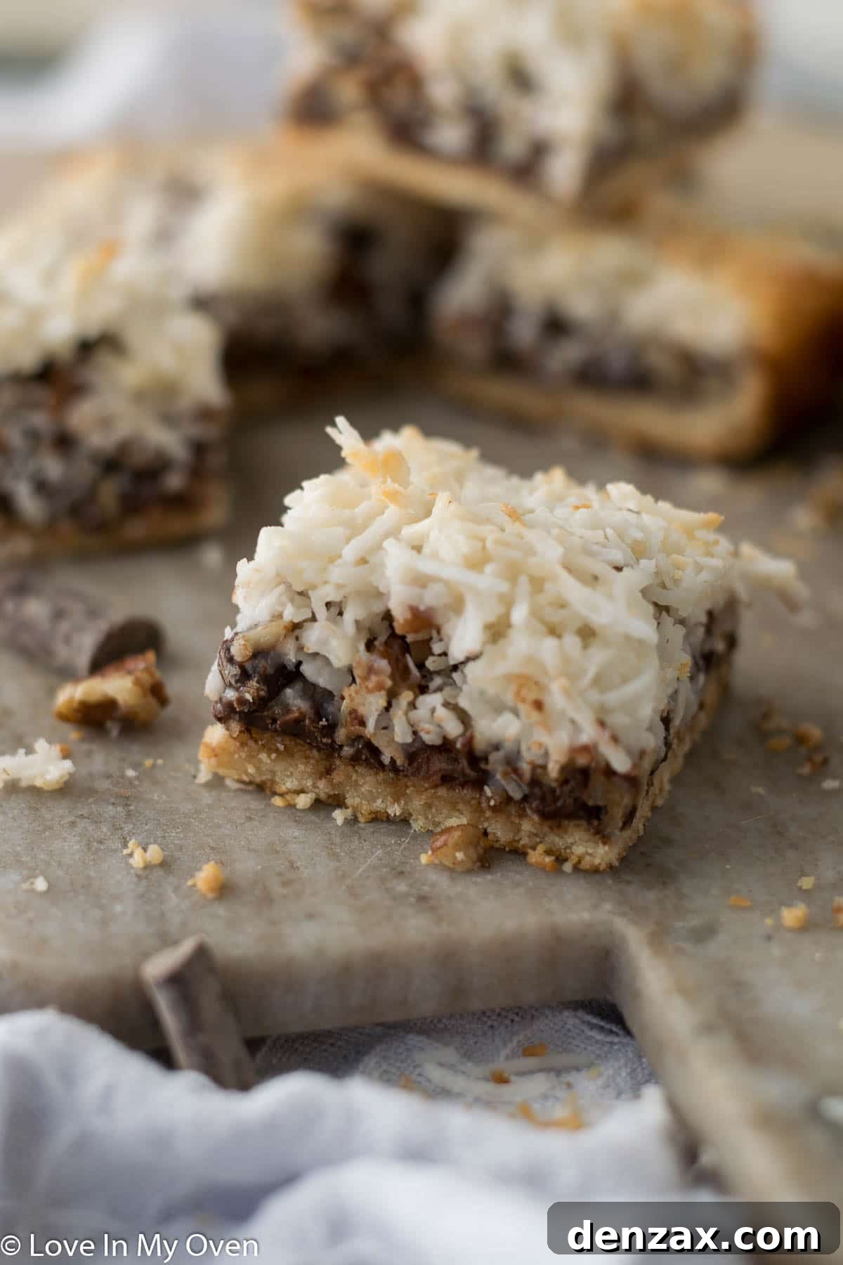 Close-up of a single vegan magic bar, showing off its intricate layers, ready to be enjoyed.