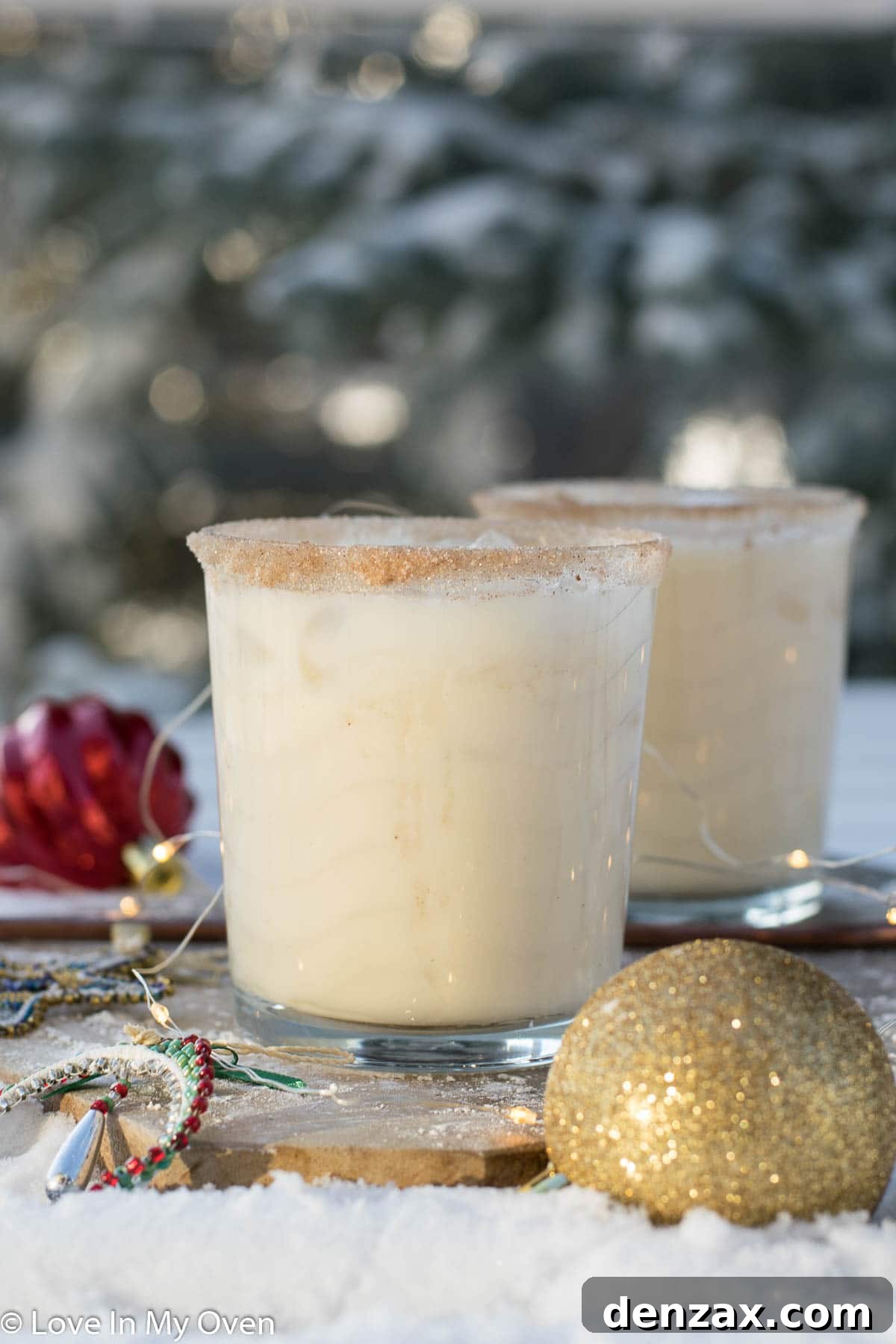 Creamy Vodka Eggnog Cocktail with cinnamon sugar rim in a festive glass for holiday celebrations