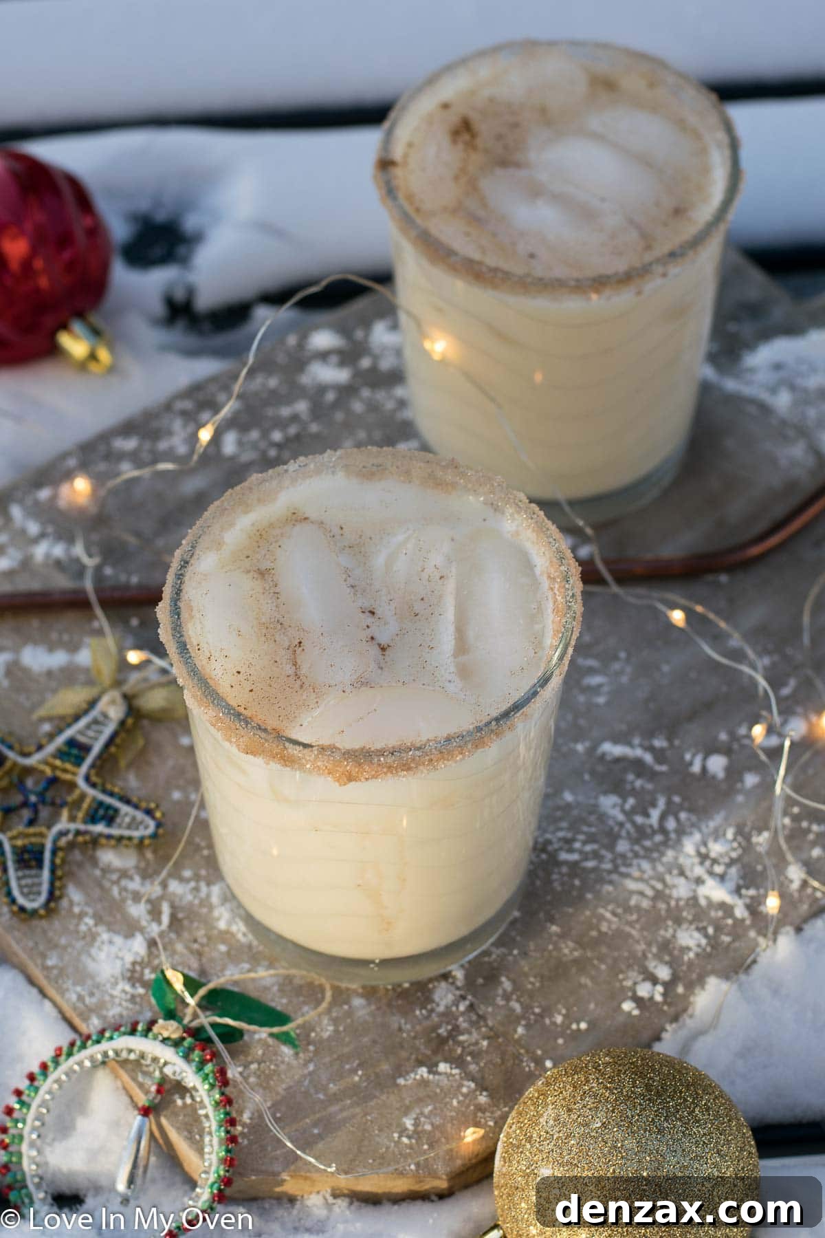 Close-up of a festive Vodka Eggnog Cocktail garnished with cinnamon and holiday spices