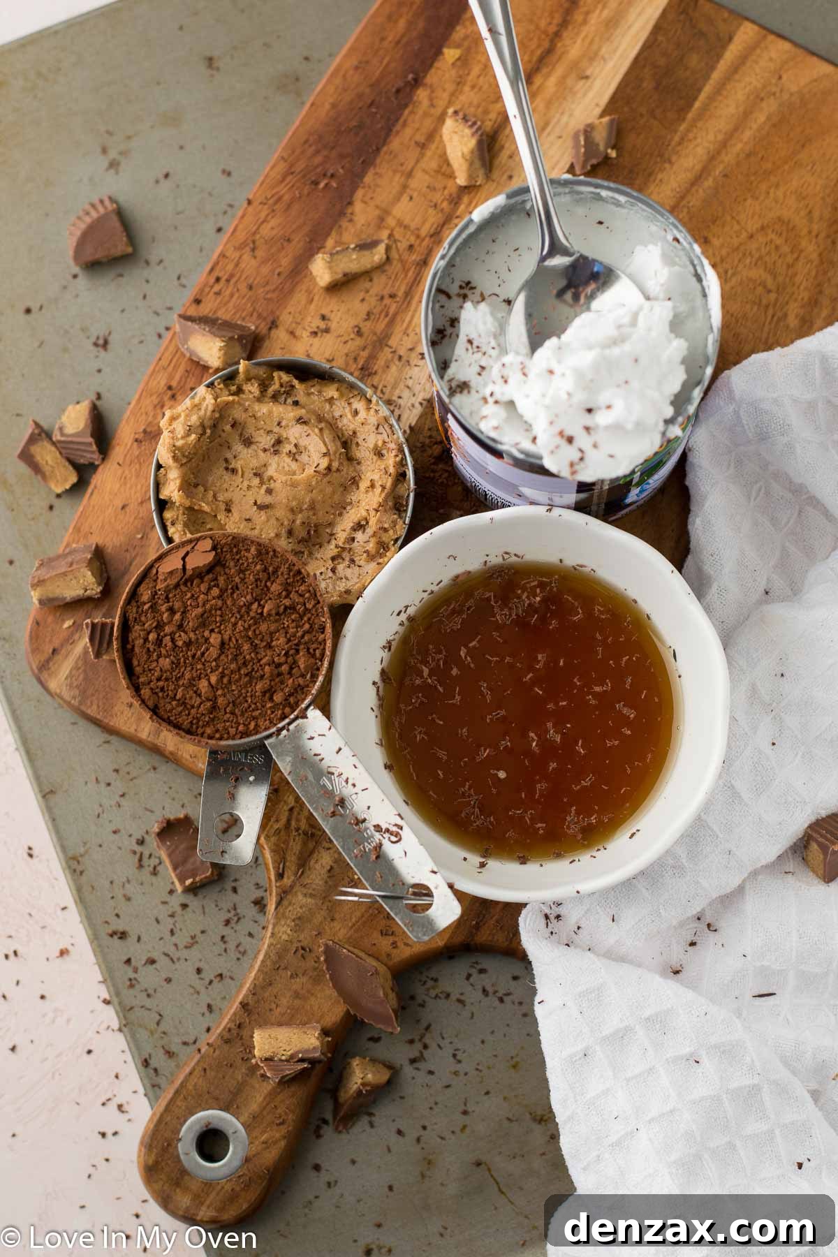 A bowl of the vegan chocolate peanut butter pudding ingredients before mixing, showcasing coconut cream, cocoa, and peanut butter.
