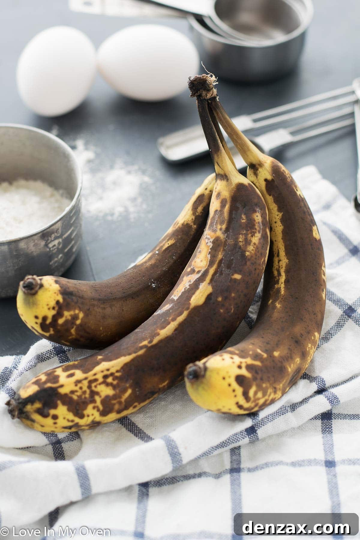 Close-up of mashed ripe bananas in a bowl, ready for the banana cake batter