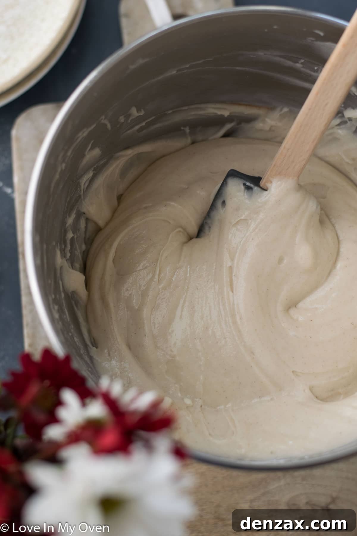 Top view of gluten free banana cake with frosting and dulce de leche swirl
