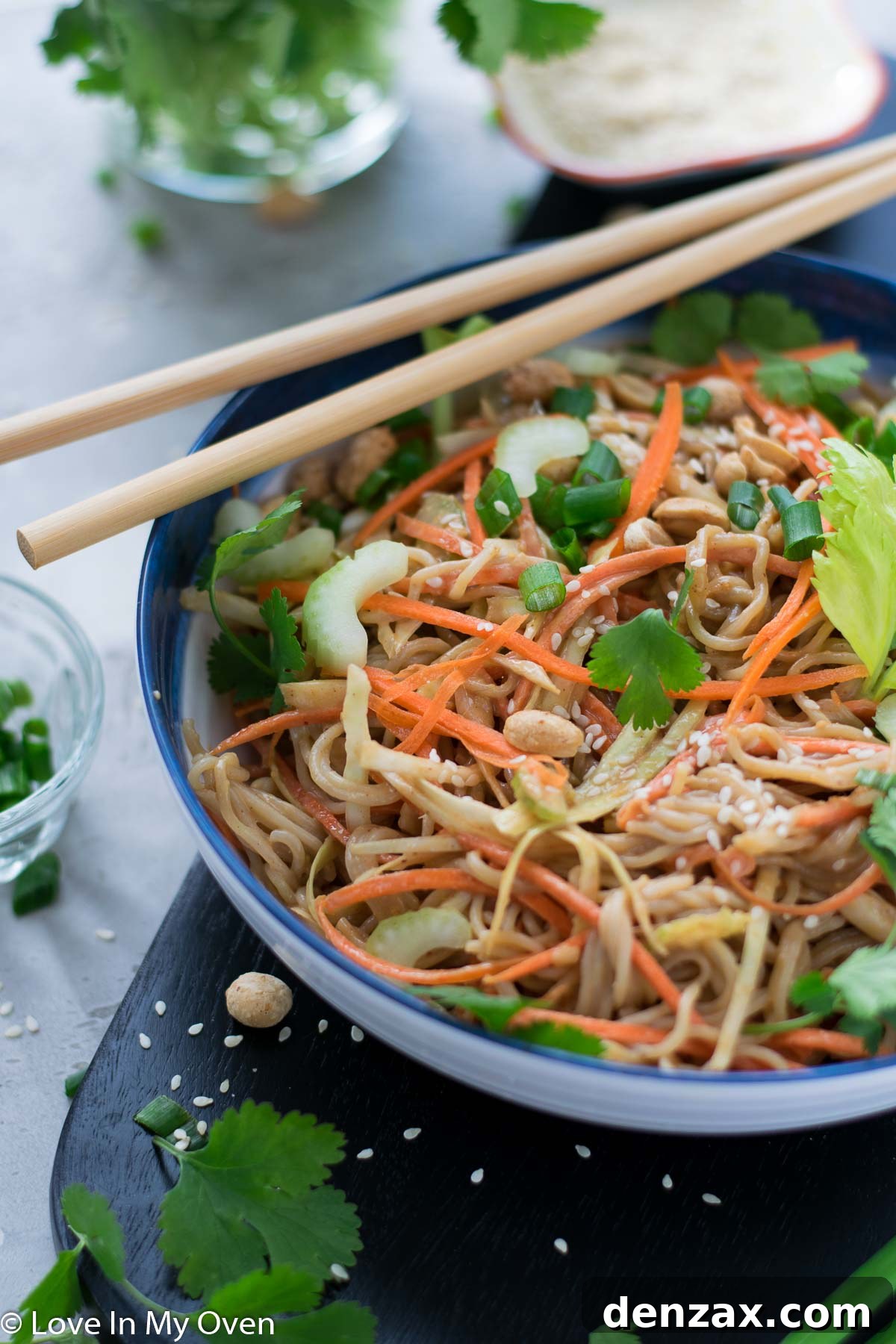 Bowl of Sesame Peanut Noodle Salad with chopsticks