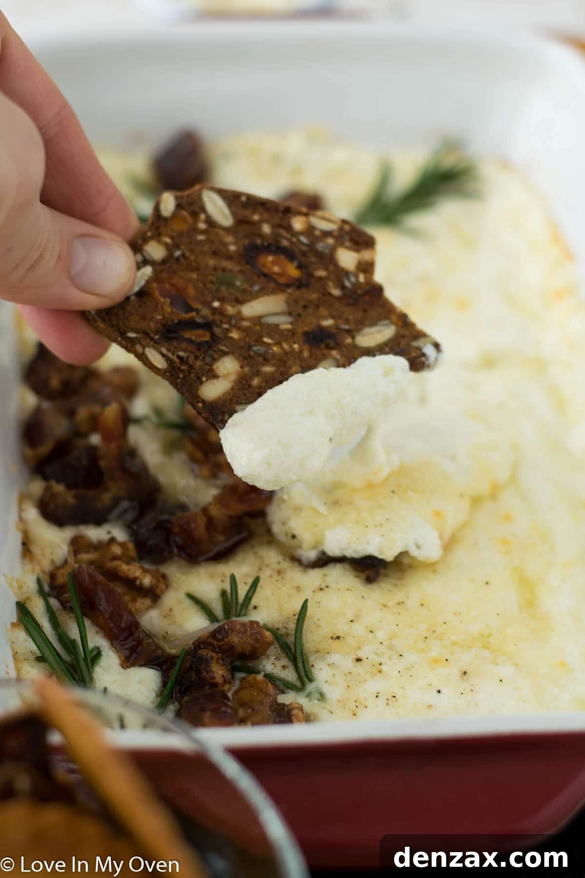 close up of baked goat cheese dip