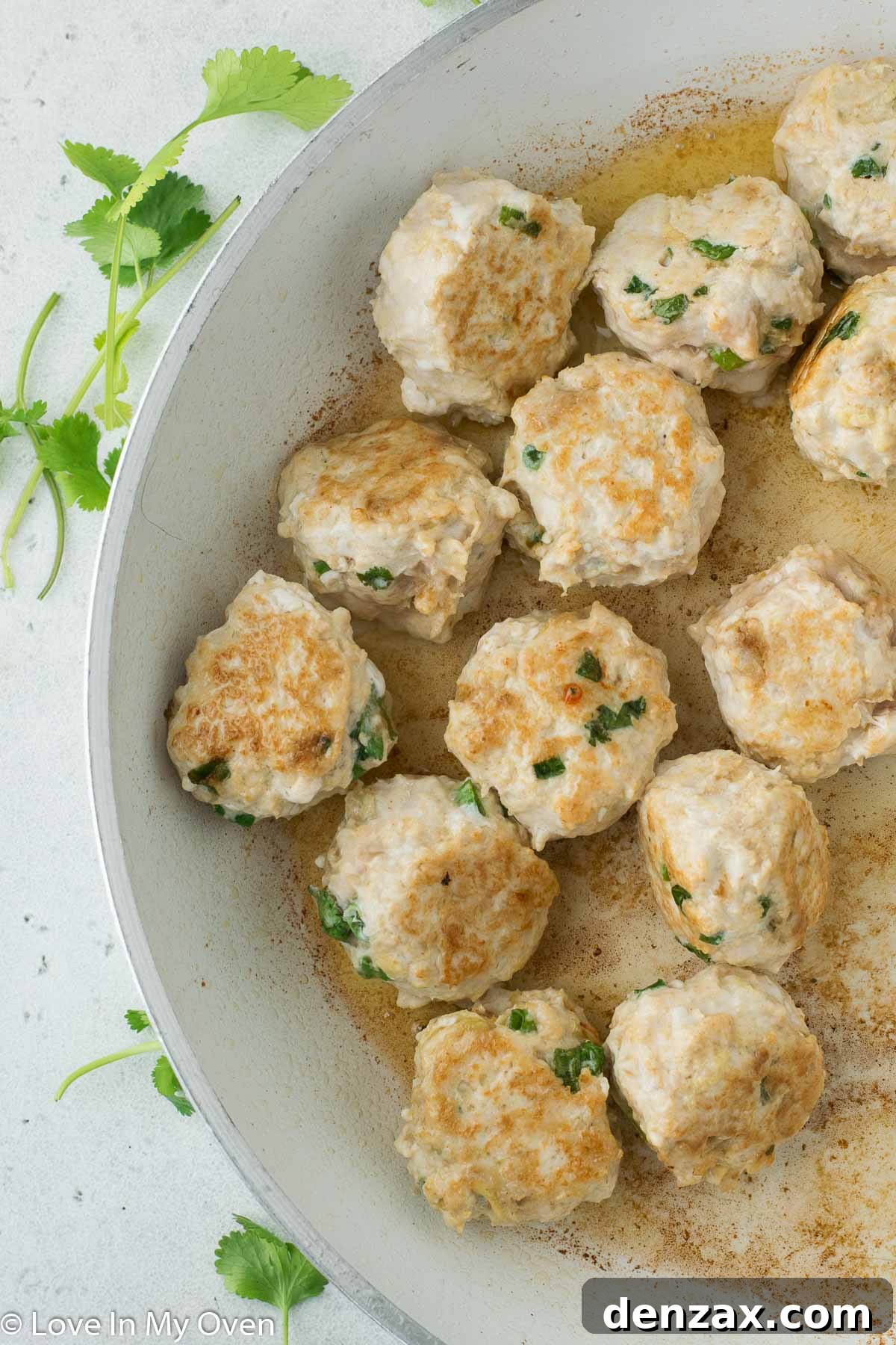 cooked chicken meatballs in pan
