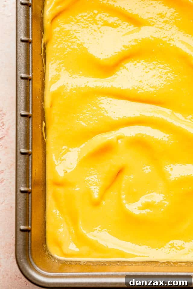 Blended mango yogurt mixture in a loaf pan before adding the strawberry layer