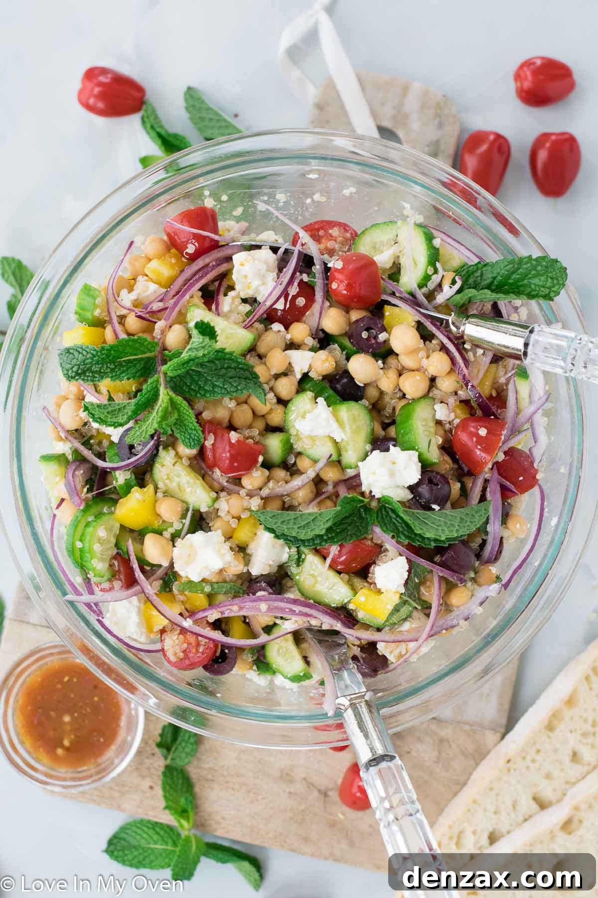 Vibrant Greek Chickpea Salad bowl featuring quinoa, chickpeas, feta, and fresh vegetables.