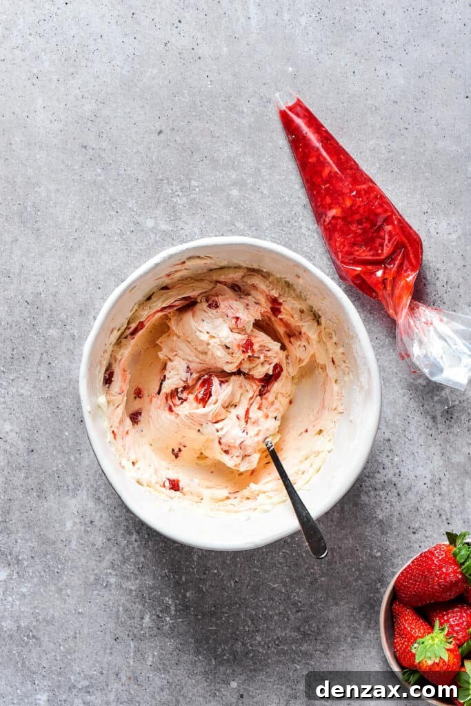 A small bowl filled with the glossy, thickened strawberry filling, ready to be used.