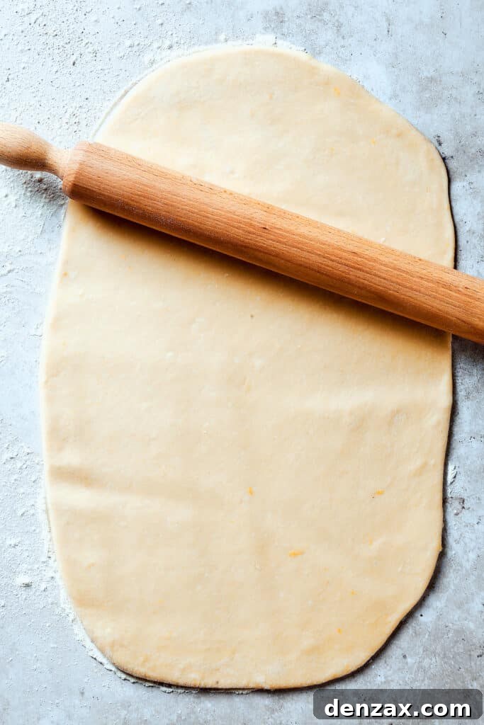 Dough rolled out into a thin rectangle.