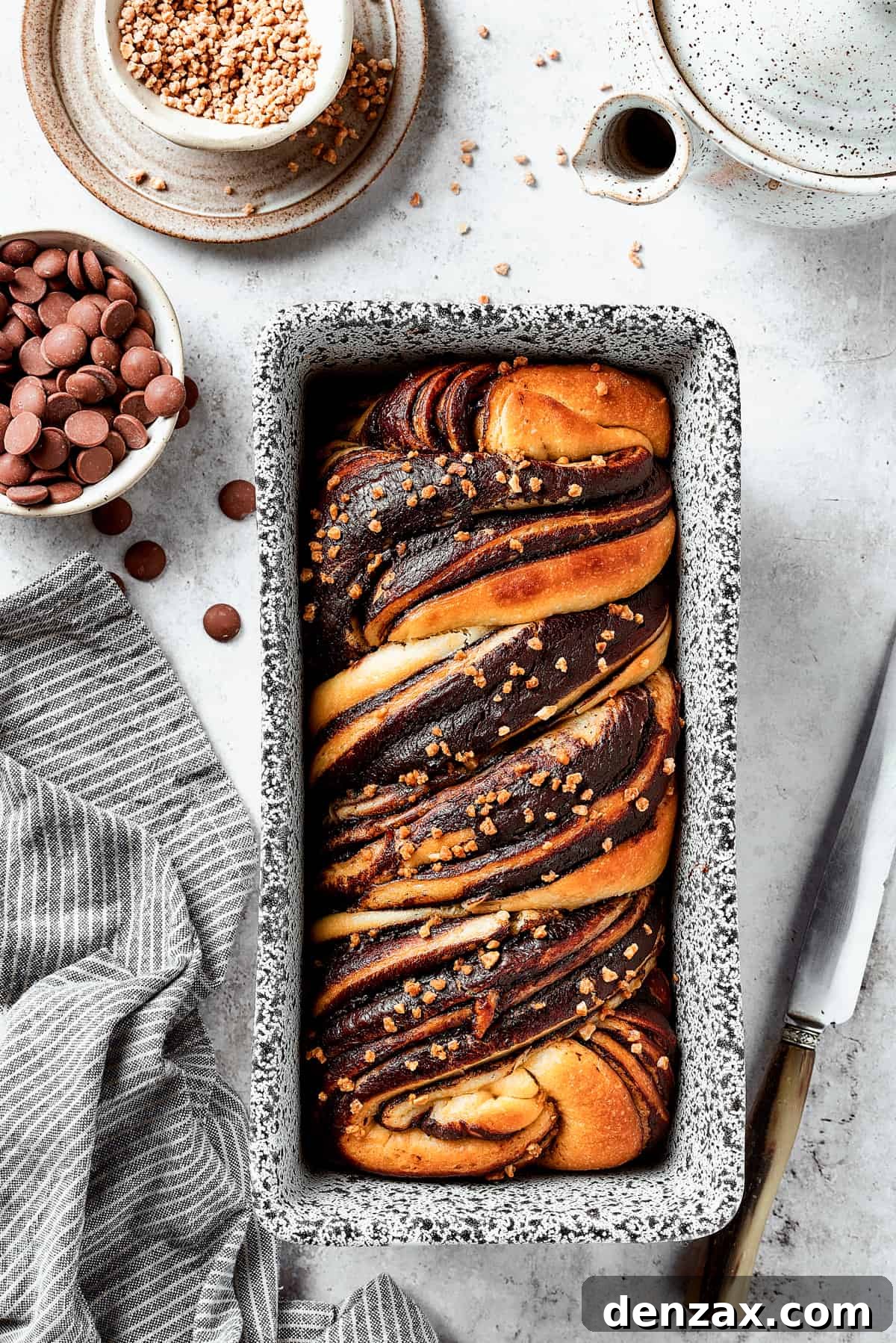 A baked chocolate babka in a loaf pan.