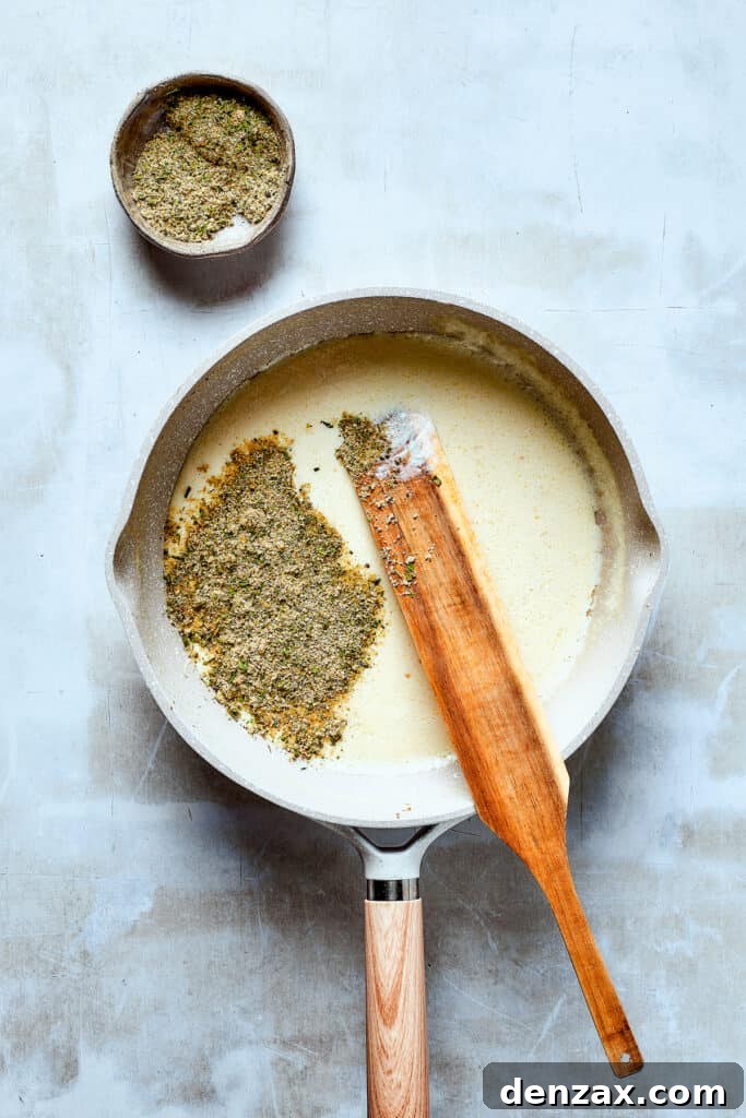 Making a rich, creamy sauce in a skillet, with a smooth, luxurious texture.