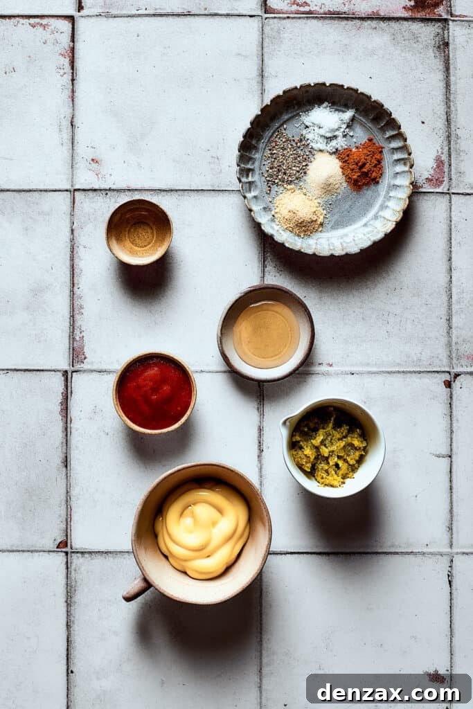 Various dressing ingredients measured out in small bowls, ready to be combined.