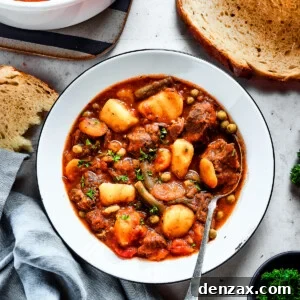 Overhead shot of beef stew with mixed vegetables.