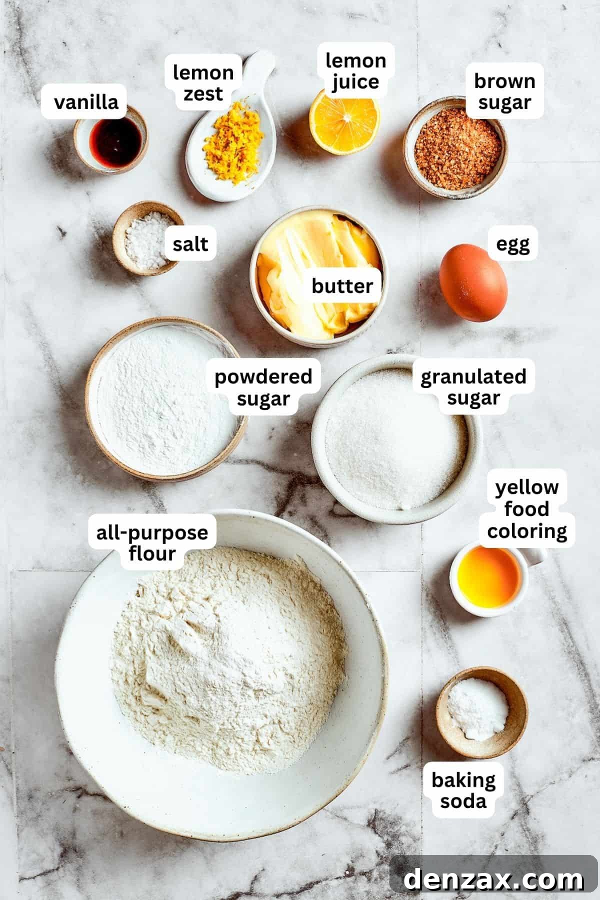 Aerial view of all the fresh and simple ingredients used to make delightful lemon cookies, neatly arranged on a flat surface.