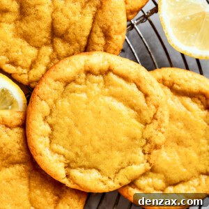 Close-up shot of several lemon cookies arranged on a round wire rack, highlighting their soft, tender, and chewy texture.