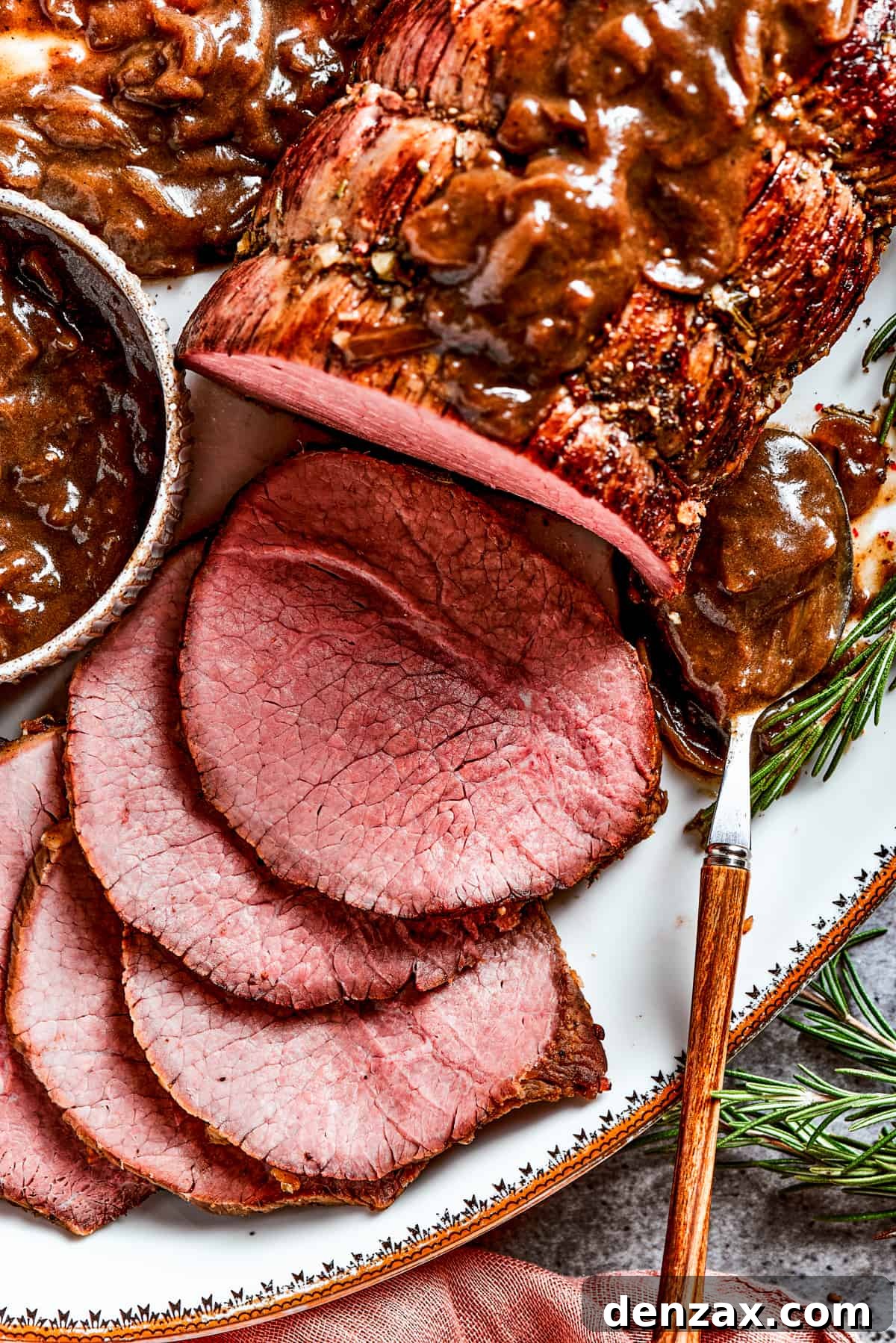 Close-up image of a sliced top round roast.