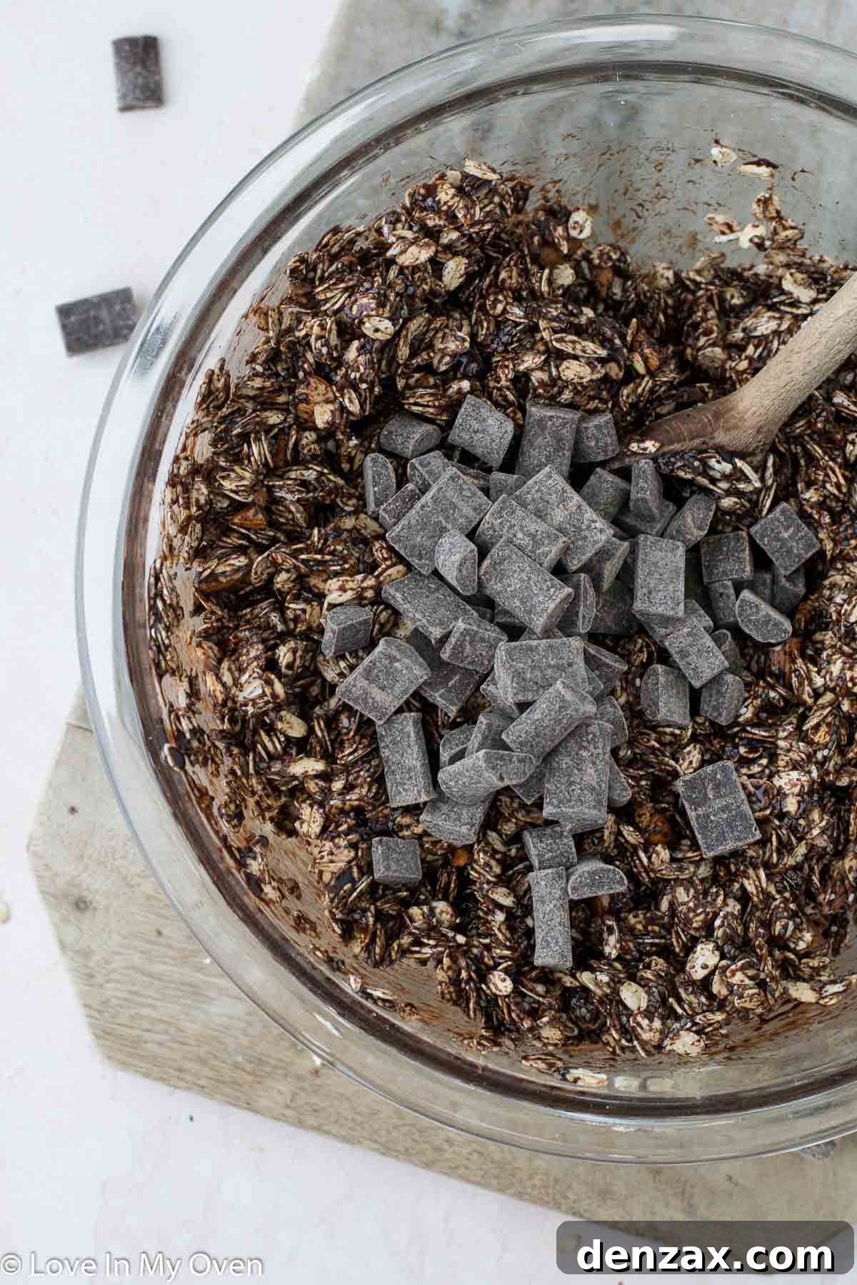 Close-up of wet and dry ingredients combined for double chocolate granola