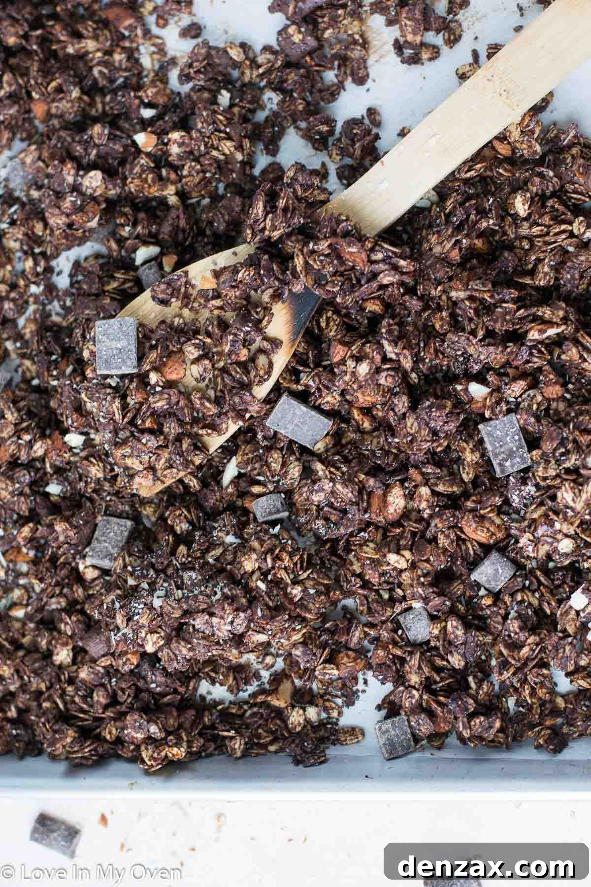 Close-up of baked double chocolate granola in a bowl, showing crunchy clusters