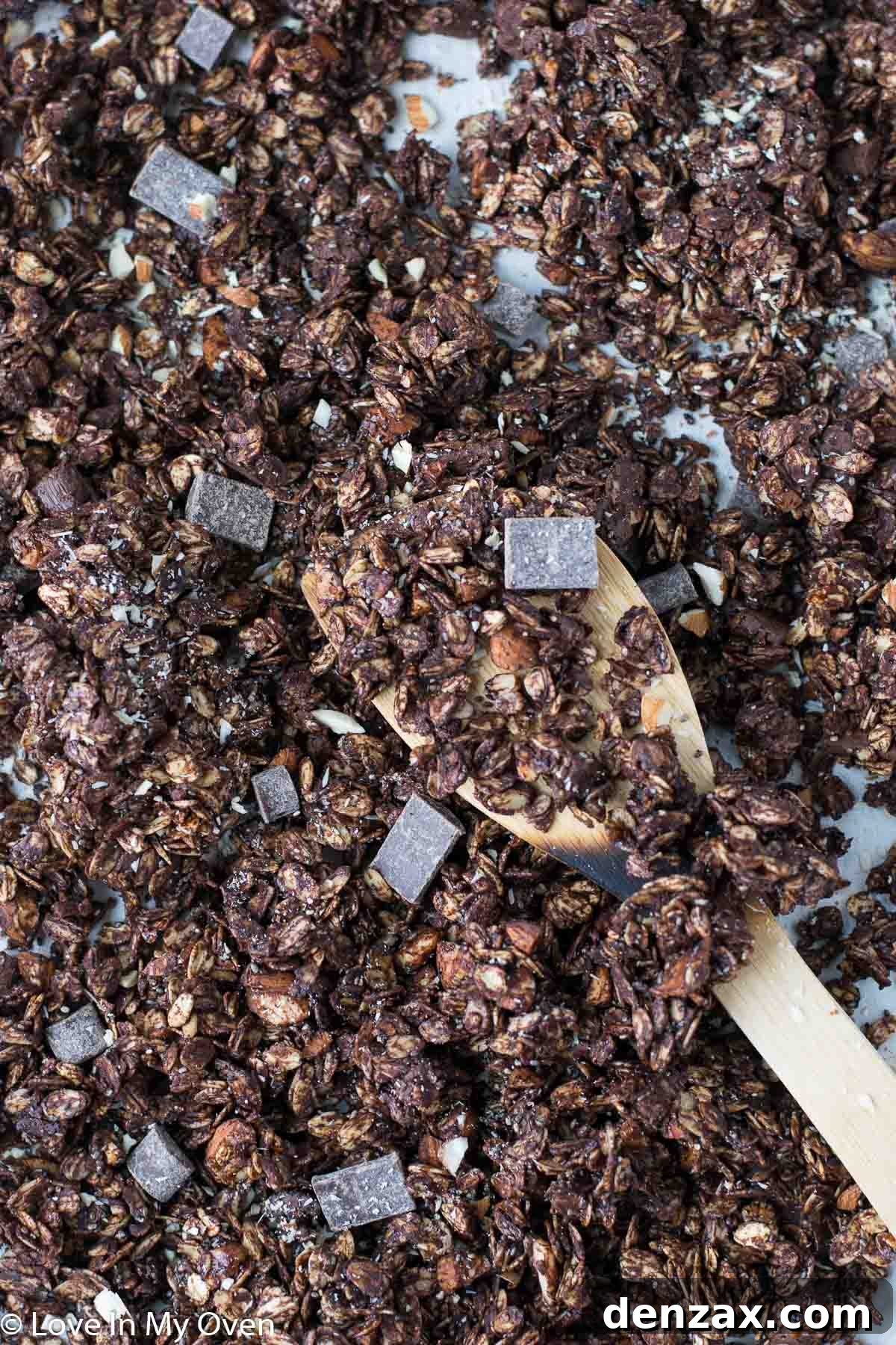 A bowl of double chocolate granola served with fresh berries and yogurt, perfect for breakfast