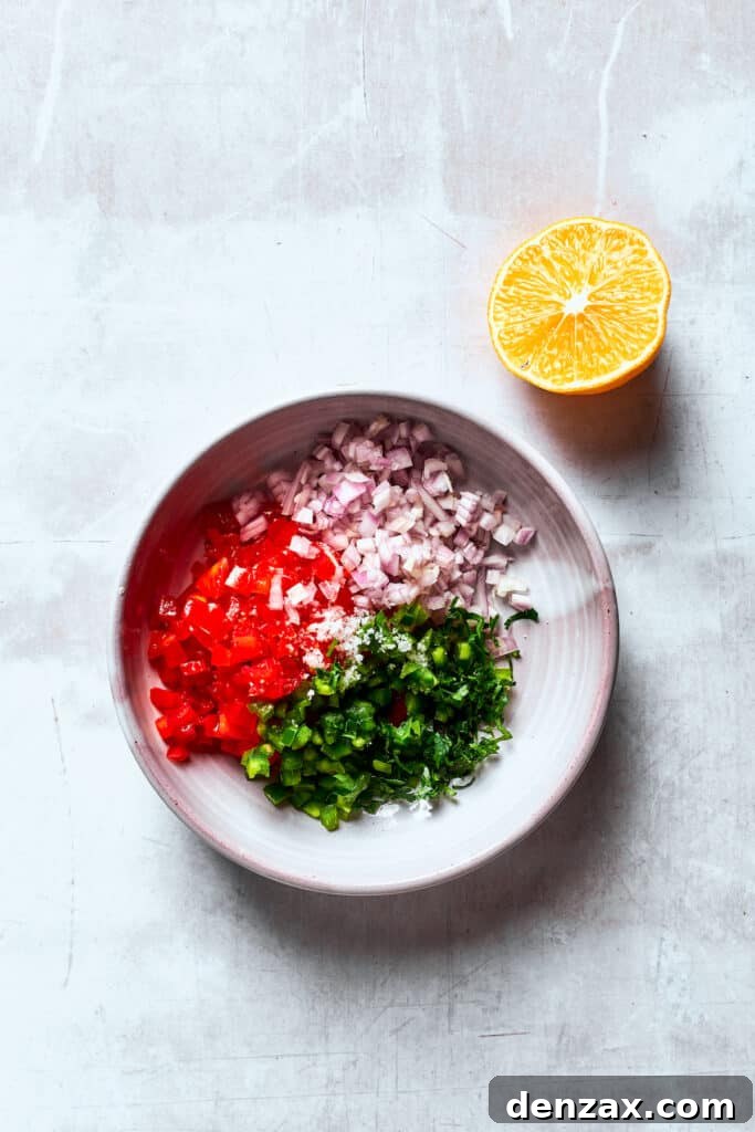 Pico de gallo ingredients are placed in a white bowl.