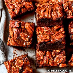 Pecan Pie Brownies lined on parchment paper.