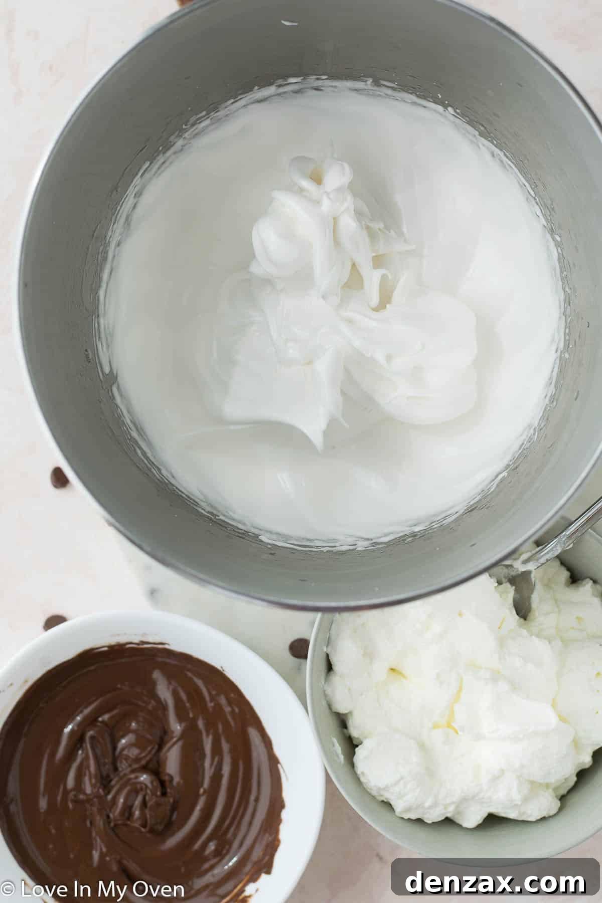 Folding meringue into whipped cream for semifreddo