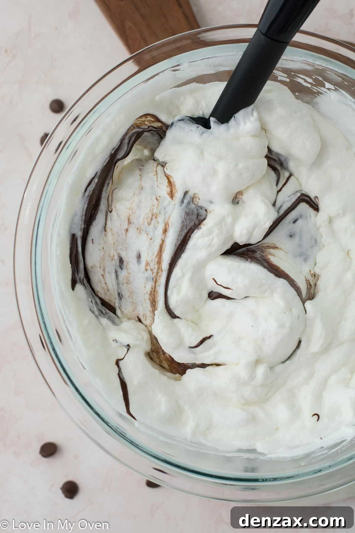 Adding melted chocolate to the semifreddo base