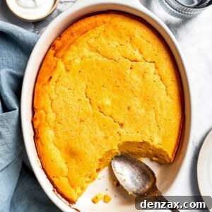 Overhead image of a golden-baked Spoon Bread in a casserole dish, ready to be served.