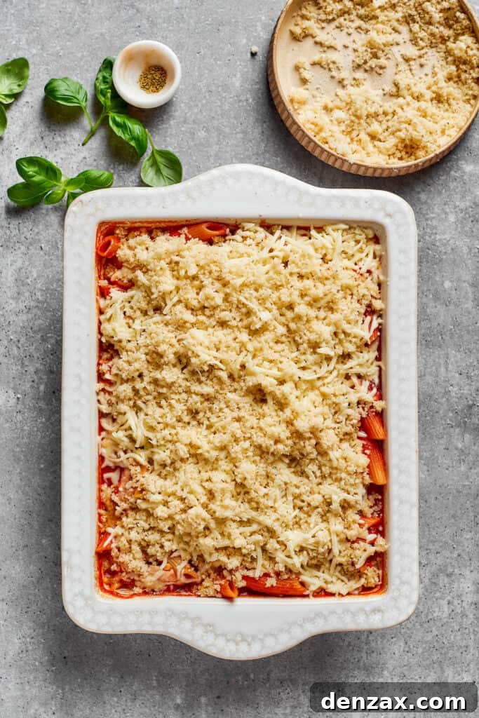 The breadcrumb topping is added to the top of the casserole.