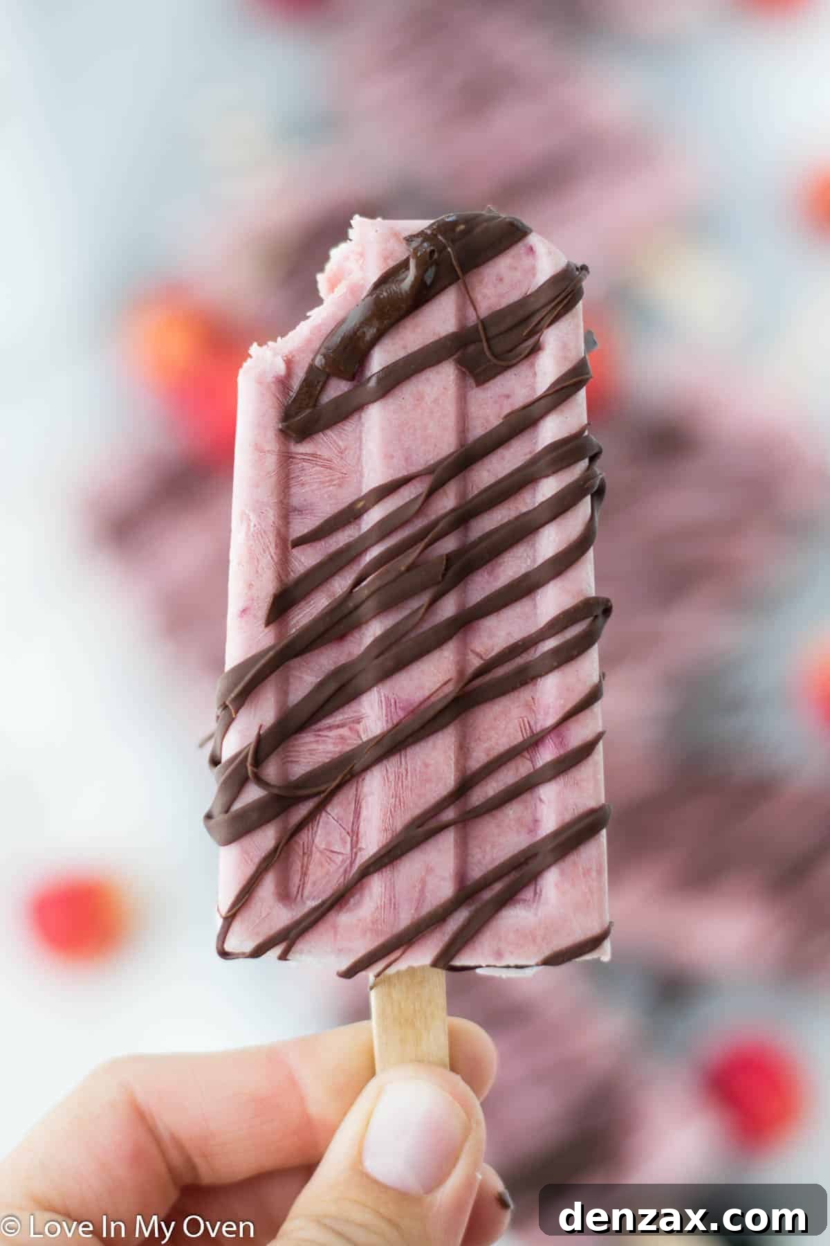 Close-up of Greek yogurt cherry popsicles with chocolate